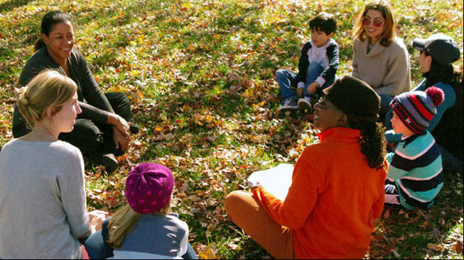 Educator talks with group
